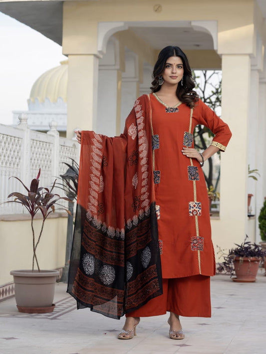 Classic Orange Kurta Set with Artistic Patch Detailing & Dupatta